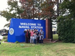 Squadron members rendering a salute to former shipmates. From left to right standing are Chief Larry Mondy (VA.), Sal Mantineo (DE.), Charles “Greek” Galowina (OH.), Joe Smilling (VA.), Vince Geraldi (N.J.), John Fugett (AL.).  Kneeling are Ken “Stoney” Field (ME.) and Bill Payne (VA.)